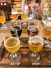 Tasting different types of craft beer and uploading photos to social networks from smartphone