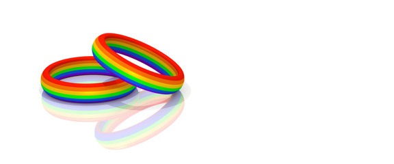 Two wedding rainbow colored rings on white background