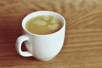 Fresh tasty espresso cup on background. Morning cup of coffee for a good start of the day