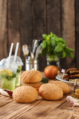 Obraz na płótnie Canvas round buns with sesame - bun pastries (sandwich) - cuisine. Food background