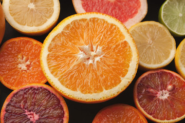 Cut citruses closeup. Juicy background
