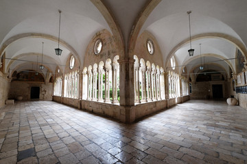 The cloister of the Franciscan monastery of the Friars Minor in Dubrovnik, Croatia  - obrazy, fototapety, plakaty