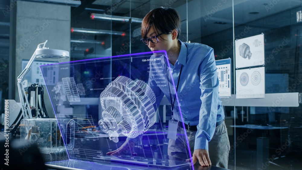 Poster asian neural network engineer uses modern computer with transparent holographic display. monitor sho