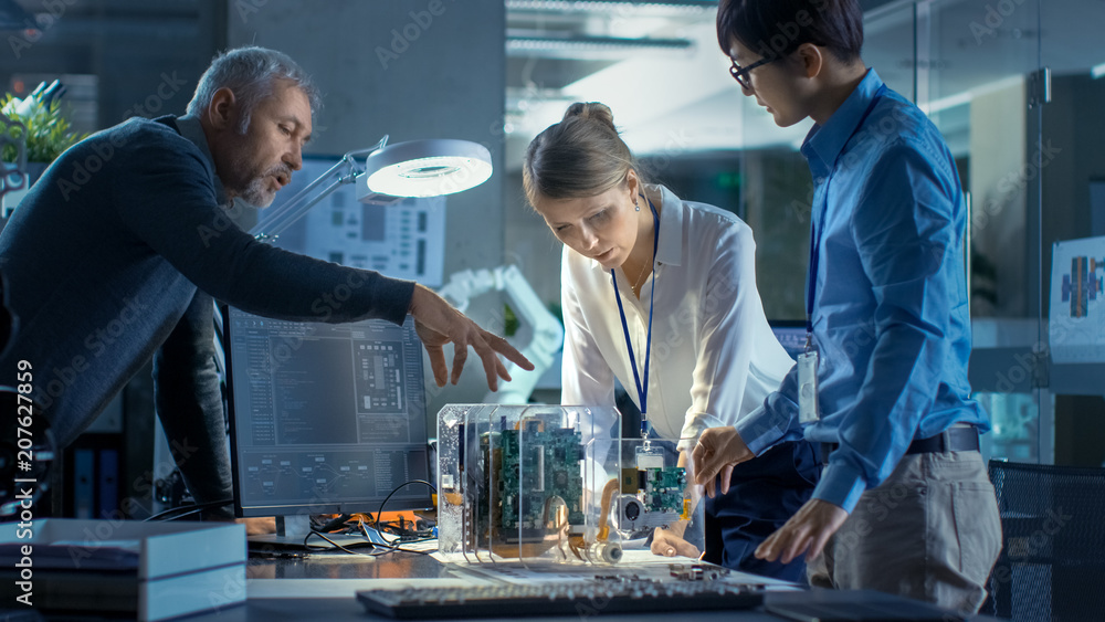 Wall mural team of engineers working in computer science research lab