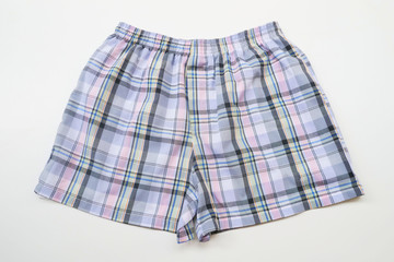 Men's boxer shorts on wood background
