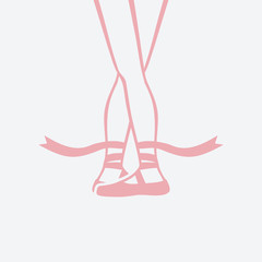 ballerina feet in pointe shoes. fifth ballet position