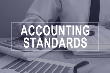 Accounting standards concept. Man working with report.