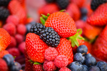 fresh fruits close up view - strawberry, blueberry, red berry, raspberry, blackberry
