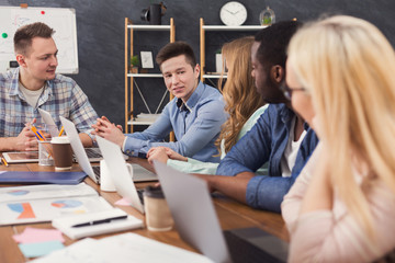 Young team discussing project in modern office