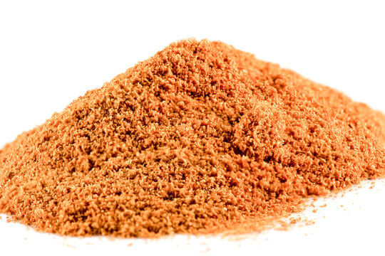 Cayenne pepper is a pile on a white background.