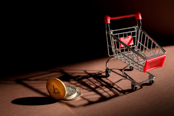 golden bitcoin and shopping cart