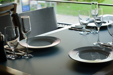 Empty glasses in restaurant, table setting