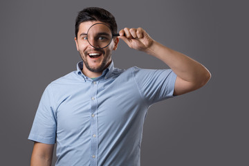 Fototapeta premium Young man with magnifier