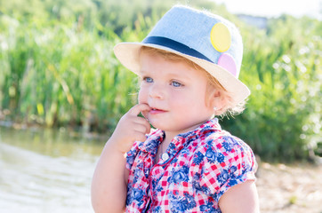 Portrait of a thoughtful girl with blue eyes in a headdress