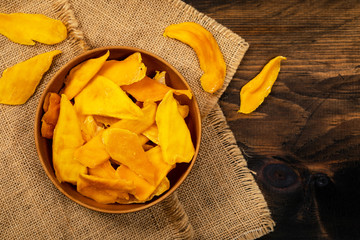 Dried Mango Fruit on Wooden Background. Selective focus.