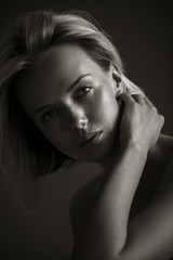 Blonde woman is looking at camera