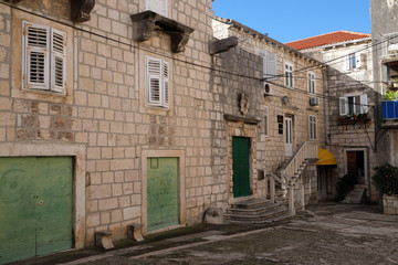 Fototapeta na wymiar Square of the Holy Justine in Korcula old town, Croatia. Korcula is a historic fortified town on the island of Korcula.