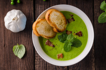 Pea soup, fresh herbs and bacon