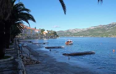 Obraz premium Seafront view at picturesque medieval Dalmatian town Korcula, Croatian culture and historic destination.