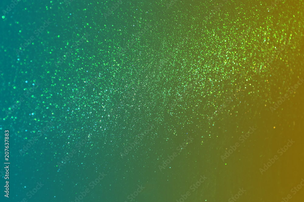 Wall mural green sparkling and shining star points on a gradient yellow green background will create a festive 