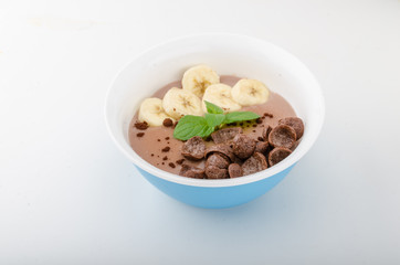 Chocolate pudding, banana and herbs in
