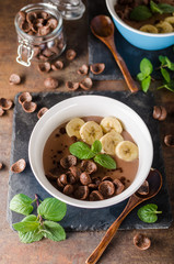 Chocolate pudding, banana and herbs in