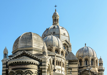 Obraz premium Close-up view of the cathedral of Marseille, Sainte-Marie-Majeure, also known as La Major, a neo-byzantine style catholic building achieved in 1893, showing several cupolas, chapels and turrets.