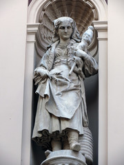 Statue on facade of the old city building in Zagreb, Croatia