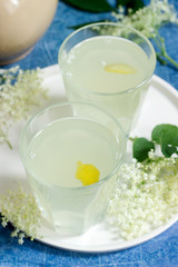 Obraz na płótnie Canvas Cold sokata - a traditional Romanian drink made from the flowers of elder and lemon, produced by fermentation.