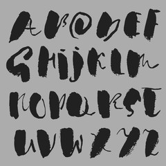 Handdrawn dry brush font. Modern brush lettering. Grunge style alphabet. Vector illustration.