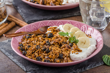 Granola baked in oven with nuts