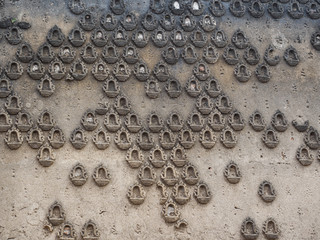 The carved wall of the deserted and sunken temple  in Sangkhlaburi District, Kanchanaburi Province, Thailand.