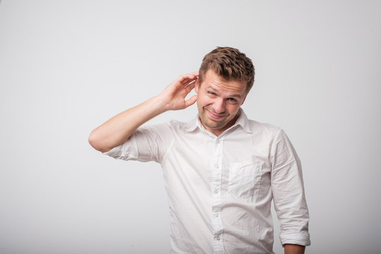 Caucasian man having doubts.