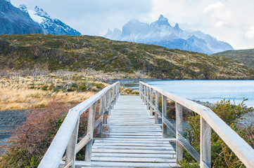 Fototapeta na wymiar Wooden walkway in Torres Del Paine National Park in Patagonia