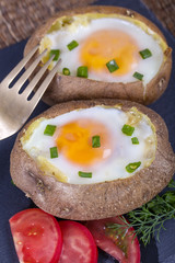 Baked potatoes stuffed with cheese and egg