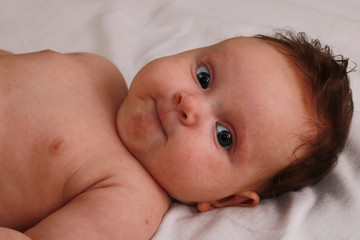 Portrait of the newborn child. Kid.
