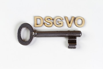 DSGVO word in wooden letters with old key