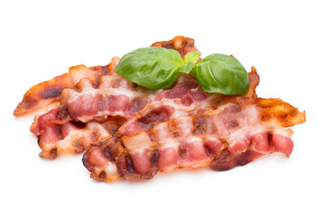 Cooked bacon rashers isolated on white.