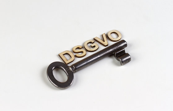 DSGVO word in wooden letters with old key