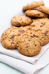 Chocolate oatmeal cookies on the  wooden background.