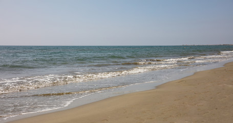 Fototapeta na wymiar Sandy beach and sea water background.