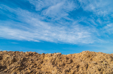 Mound and blue sky