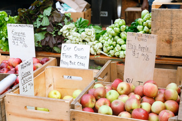 Apples at the summer outdoor farmers market. Healthy and local food and community concept