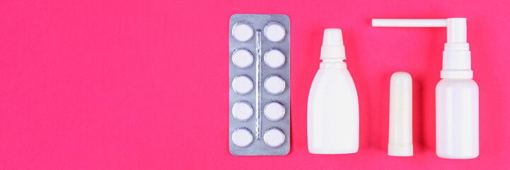 Medical remedies for colds, flu on a pink pastel background. Top view. Flat lay. Copy space.