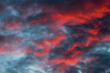 Fototapeta na wymiar majestic red and orange clouds in sky during sunset