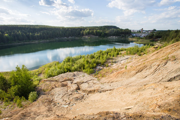 Flooded open pit quarry ore clay mining with blue water