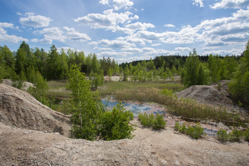 Flooded open pit quarry ore clay mining with blue water