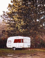 old vintage camper abandoned in an alley