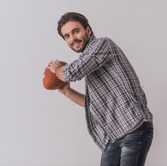 Handsome man with ball