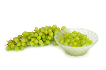 grapes green in bowl isolated on white background